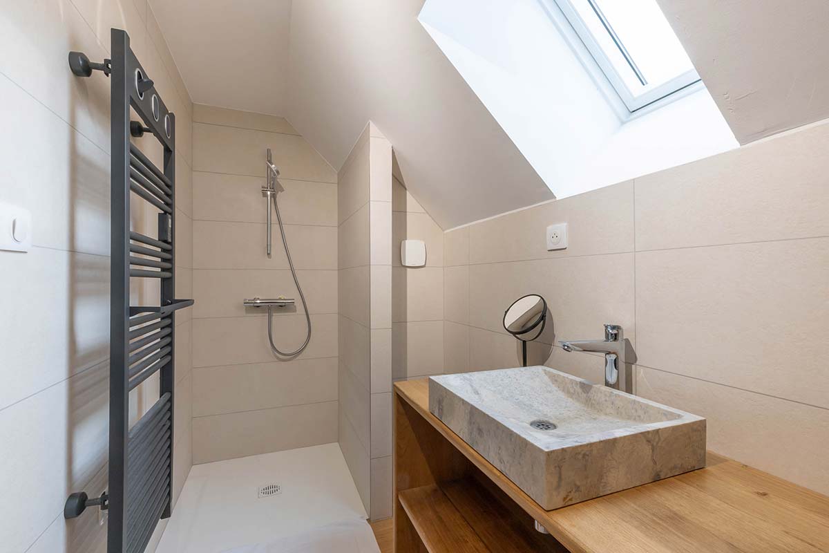 Sitting room in L'Hirondelle gîte with wood-burning stove, Villebichot